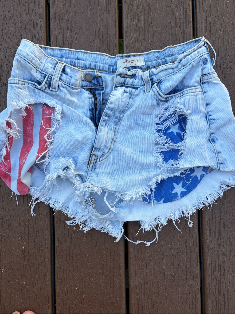 Vibrant Light Blue Distressed Denim Shorts with American Flag Insets